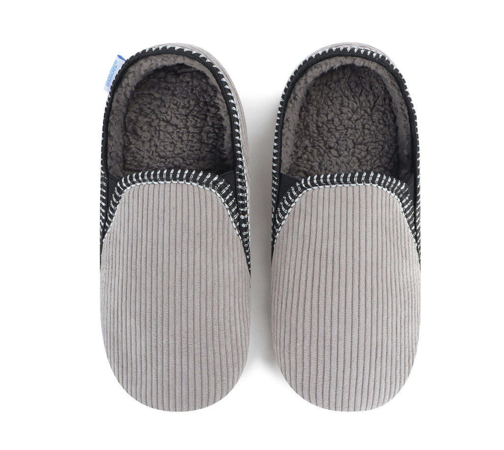 Pair of gray slippers with textured sole and fuzzy lining on a white background