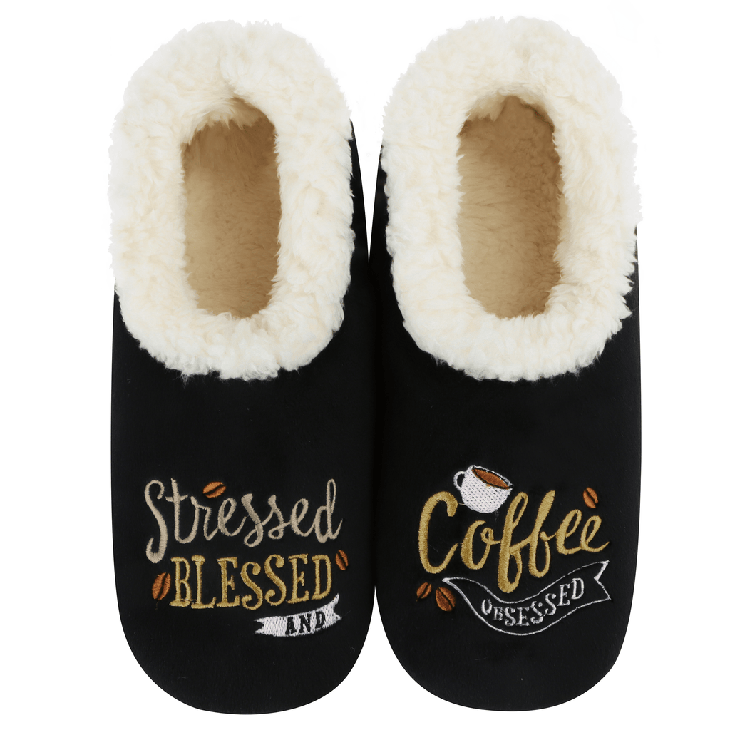 Black slippers with white fur lining and text: "stressed blessed coffee obsessed" design on a white background