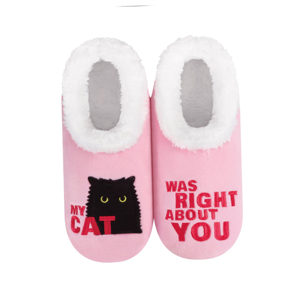 Pink socks with a black cat graphic and text "my cat was right about you" on a white background