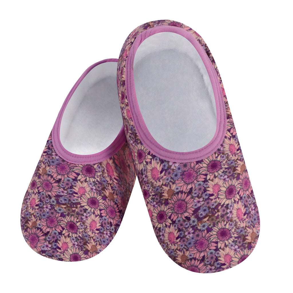 A pair of women's slippers with a floral pattern in pink and white colors, featuring a cozy sherpa lining and non-skid soles.