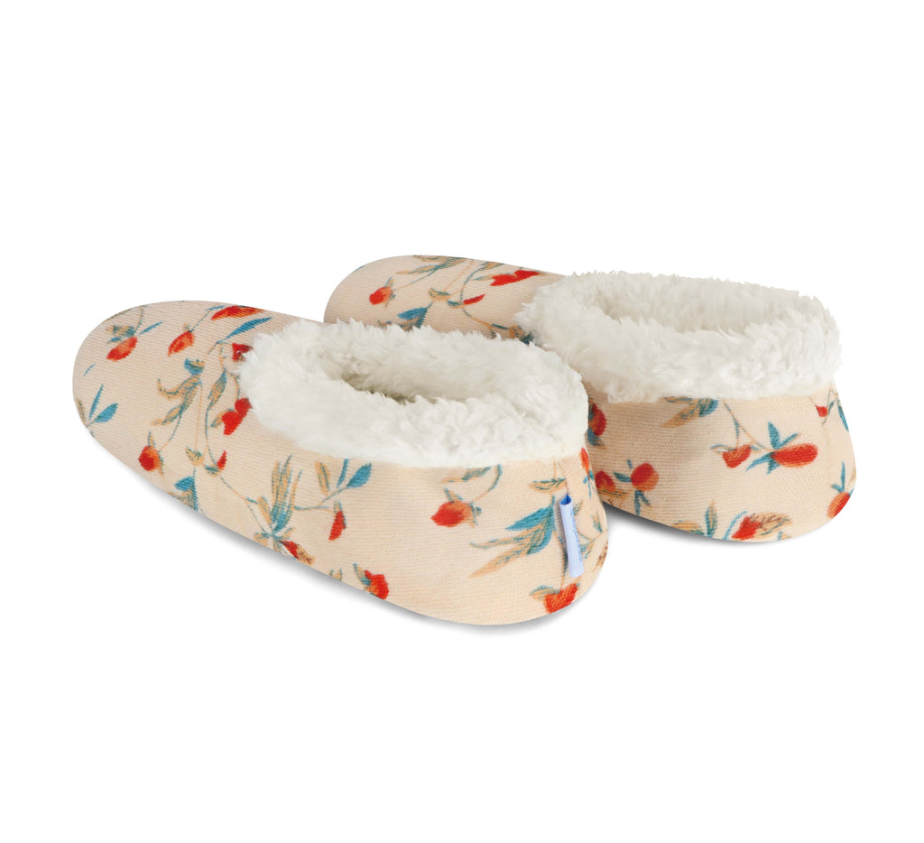 Pair of slippers with floral pattern and white interior on a white background