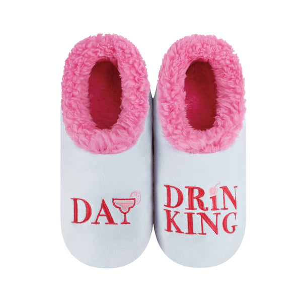 White slippers with pink interior and 'Day Drinking' text on a white background